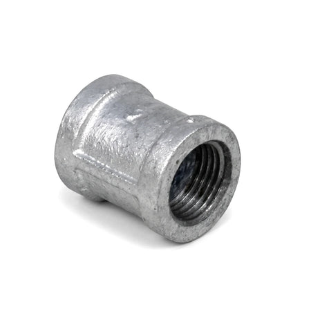A shiny metallic galvanized steel pipe socket with internal threads, presented at an angle against a white background.
