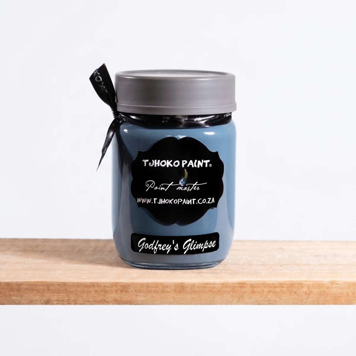 Godfrey's Glimpse 250ml Chalk Paint in a blue-gray glass jar with a black label, gray lid, and black ribbon.