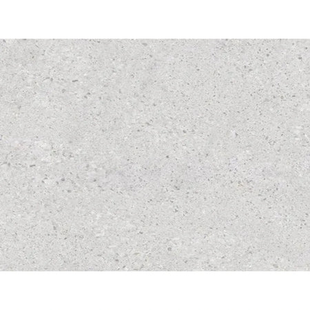 Close-up of Granada Ash light gray tile featuring a speckled texture, suitable for floors or walls.