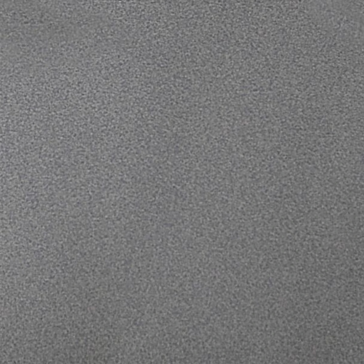 Close-up of a light grey Granito tile, showcasing its subtle granular texture and uniform color, suitable for flooring.