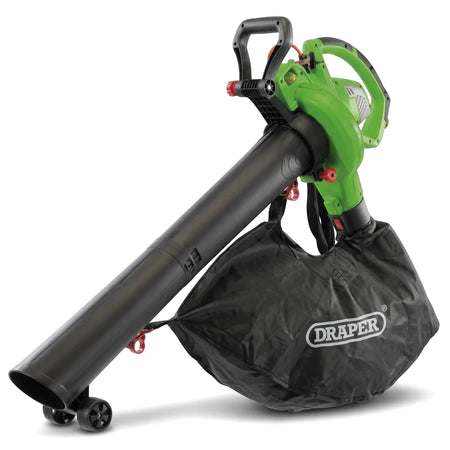 Green and black 1800W electric blower vacuum and mulcher with collection bag, shown from the side on a white background.