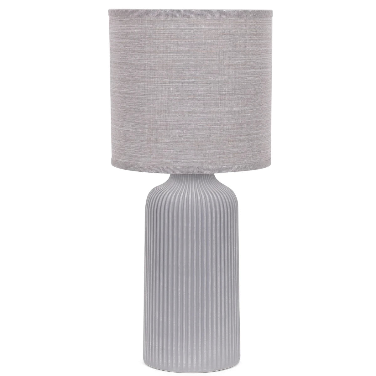 Grey fluted ceramic base table lamp with a cream fabric cylindrical shade, photographed against a white background.