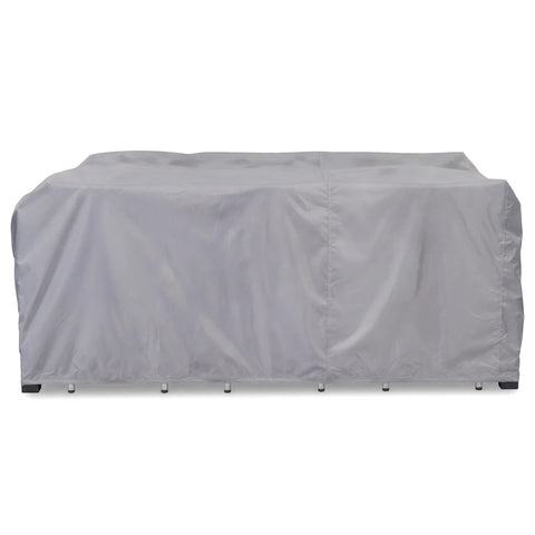 Grey protective cover for a patio furniture set, designed to shield outdoor tables and chairs from elements.