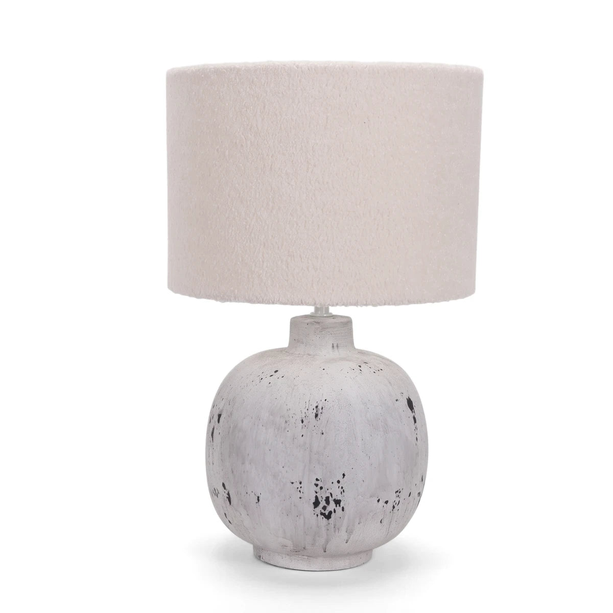 Grey stone ceramic base table lamp with a cream textured fabric drum shade, ideal for modern or rustic interior decor.