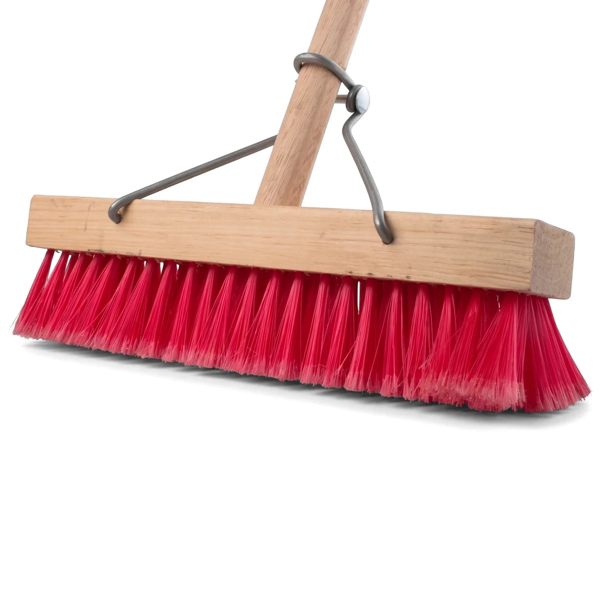 Heavy-duty household broom with vibrant red synthetic bristles and a natural wooden handle, viewed at an angle.