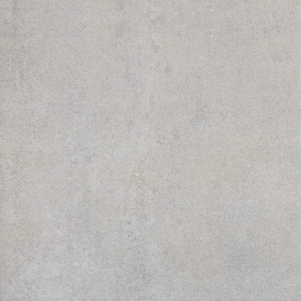 Close-up of a Highlands Mist tile, showcasing its light grey, textured surface with a subtle, speckled pattern.