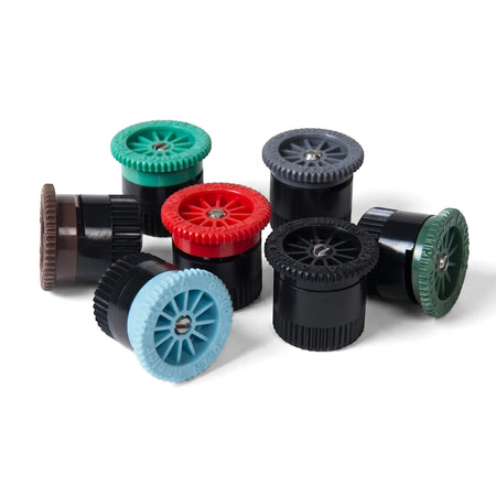 Seven multi-colored Hunter Pro adjustable irrigation nozzles (0-360°) arranged on a white background, showcasing various