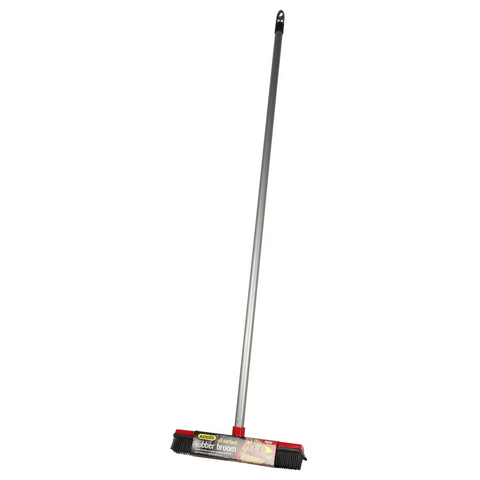 Addis rubber broom with a long metal handle and a red and black brush head