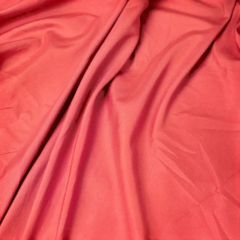 pink microfiber pillow case showing soft fabric folds and creases