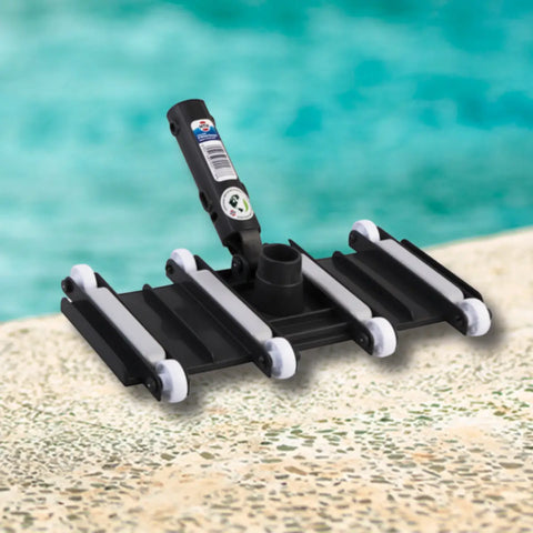 black pool cleaning tool with multiple white wheels and a vertical handle on a pool deck