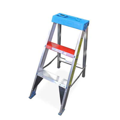 Industrial aluminum step ladder with a blue utility tray and red top step, viewed from an angled perspective on a white