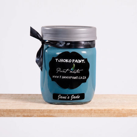 Jane's Jade 500ml Tjhoko Chalk Paint in a glass jar with a black label, gray lid, and ribbon.