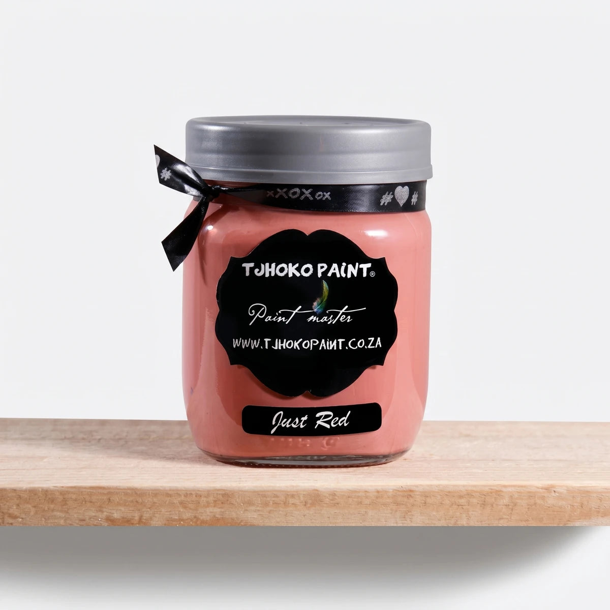 Just Red 500ml Chalk Paint in a glass jar with a gray lid and black label, sitting on a wooden shelf.