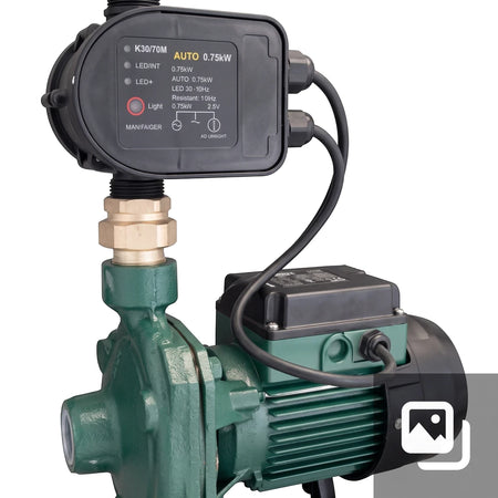 Green K30/70M AUTO 0.75kW water pump with a black control unit and brass fitting, seen from a slightly elevated angle.