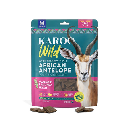 Karoo Wild African Antelope Rosemary Seasoned Treats Trailbites dog food in a vibrant teal and pink stand-up pouch, with