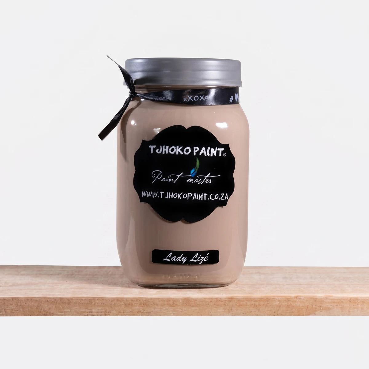 Lady Lize 250ml Chalk Paint in a glass jar, beige-taupe color, with a black label, displayed on a wooden shelf.