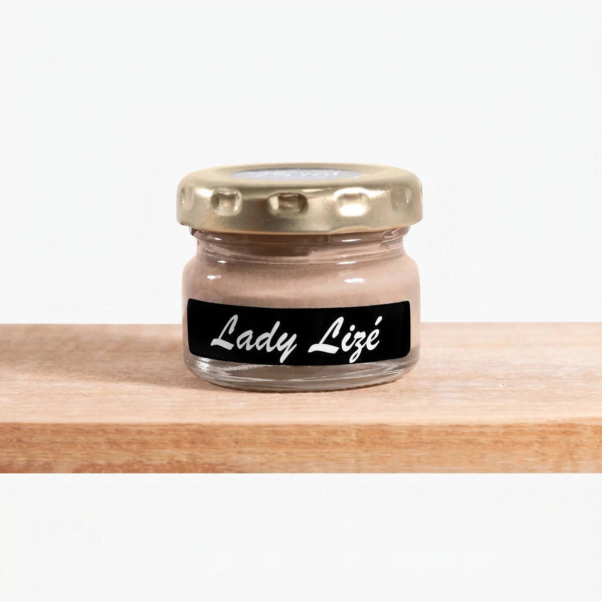 Lady Lize 25ml Chalk Paint in a small clear glass jar with a gold lid and a black label showing the brand name.
