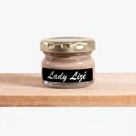 Lady Lize 25ml Chalk Paint in a small clear glass jar with a gold lid and a black label showing the brand name.