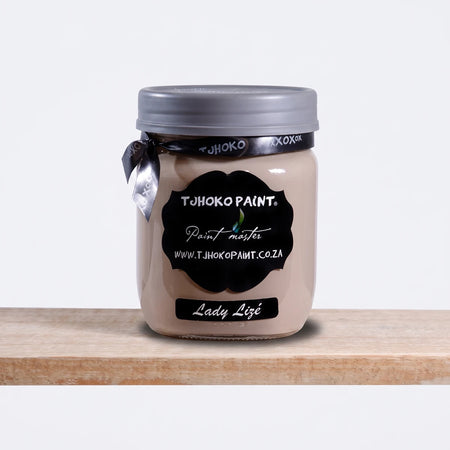 Lady Lize 500ml Tjhoko Paint chalk paint in a light beige shade, packaged in a clear glass jar with a grey lid, displayed on