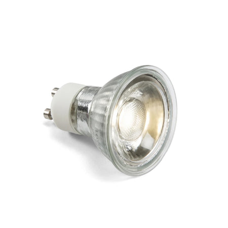 An angled view of a single LED 5W 38 GU10 6000K light bulb, featuring a glass reflector and a silver body.