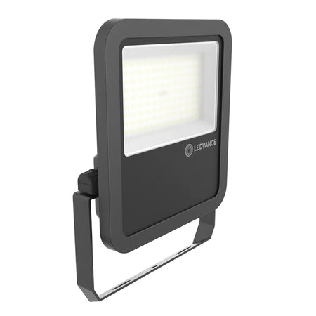 Dark gray rectangular Led Performance Floodlight 80W Daylight, IP65 rated, shown angled on its silver mounting bracket.