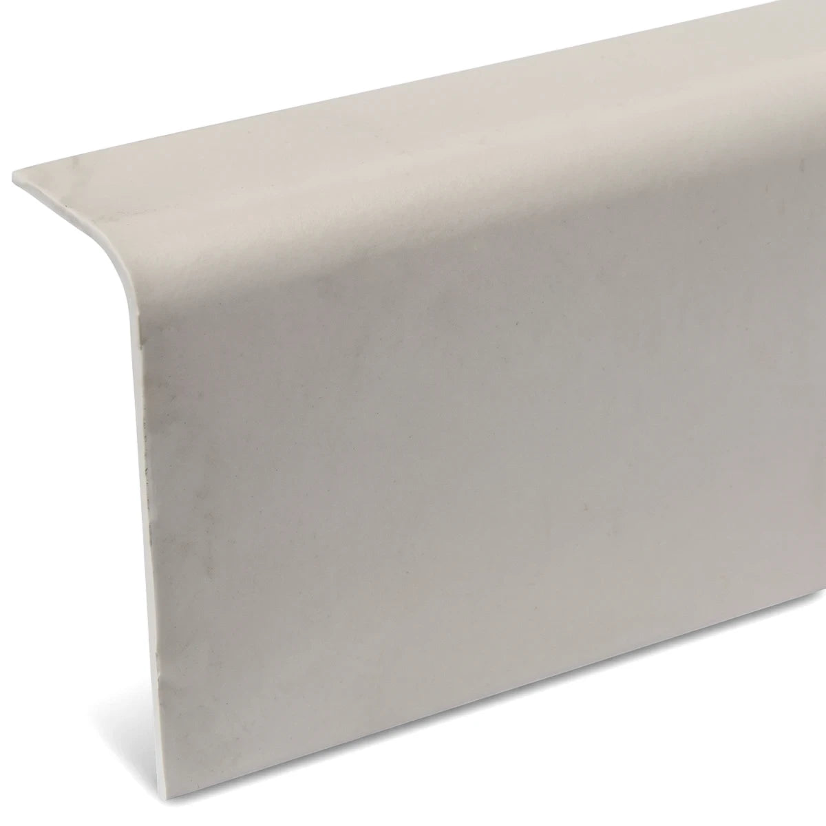 Light-colored L-shaped PVC barge board trim, ideal for exterior home finishing and protection against weather elements.
