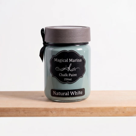 Magical Marina 250ml Chalk Paint in a teal-green glass jar with a dark grey lid and black label, standing on a wooden