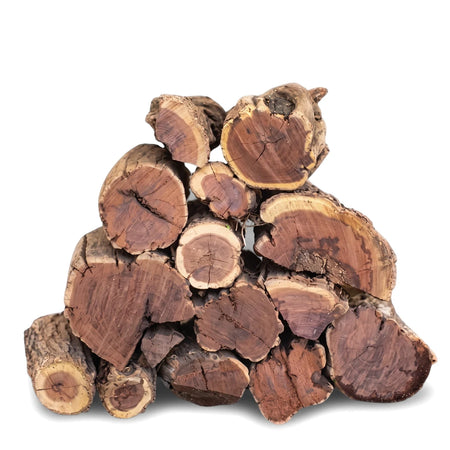 Pile of freshly cut reddish-brown and beige wood logs, showing natural grain and bark texture, stacked for a match day