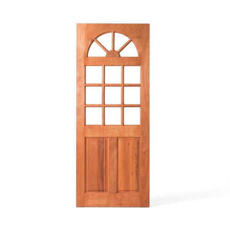 Meranti Kentucky wood door with an arched top window and nine clear glass panes in a natural finish, isolated on white.