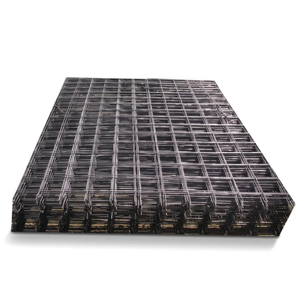 Stack of dark gray metal mesh reinforcement sheets with a square grid pattern, viewed from an elevated angle.