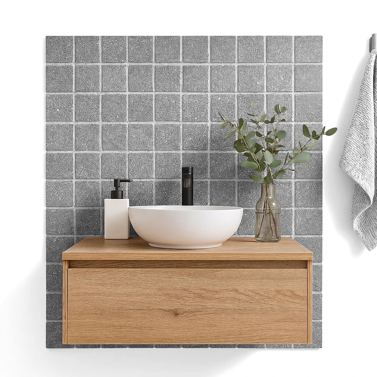 Stylish bathroom vanity with a round white sink, black faucet, and light wood cabinet, complemented by textured grey wall