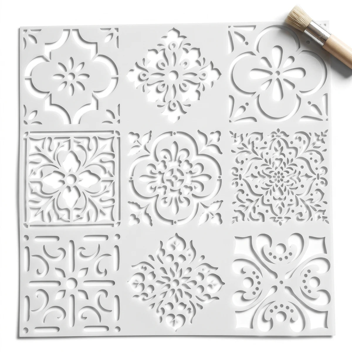 White square Moorish Mosaic paint stencil sheet with nine intricate patterns and a small brush, perfect for craft projects.