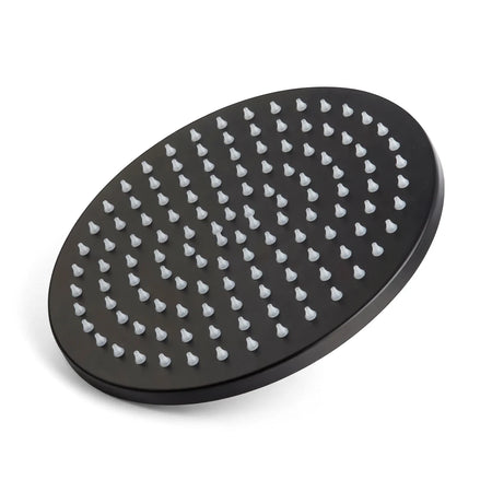 Matt black circular overhead showerhead with numerous white silicone nozzles, viewed from an elevated angle.