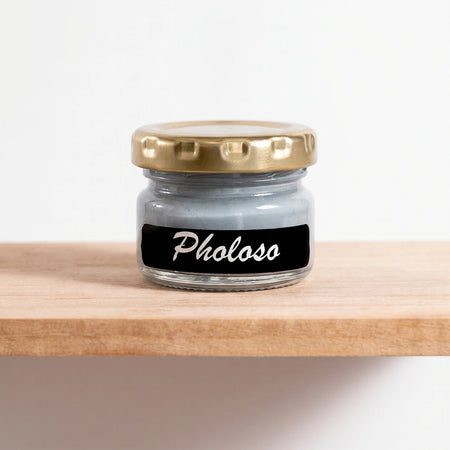 Pholoso 25ml chalk paint jar with a gold lid and a black label, displayed on a wooden shelf, front view.