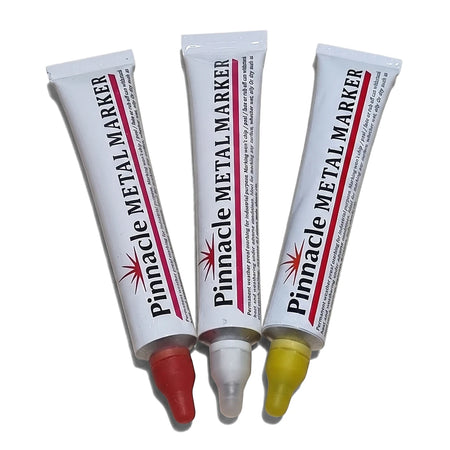 Three Pinnacle Permanent Metal Markers with red, white, and yellow tips for industrial purposes.