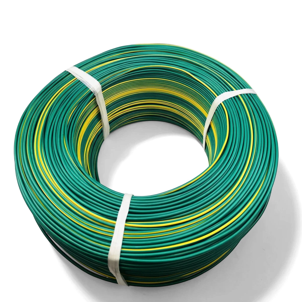 Green and yellow PVC electrical cable coiled and tied, displayed on a white background for product photography.