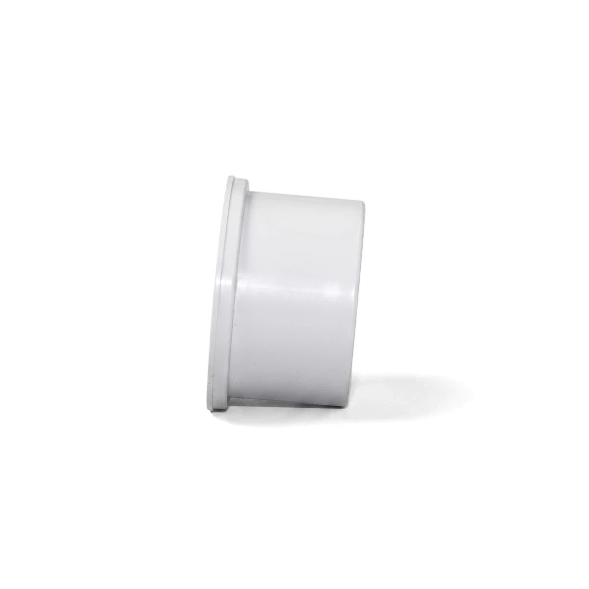 PVC End Cap Fitting 32mm in white plastic, side view, designed to seal the end of a 32mm PVC pipe.