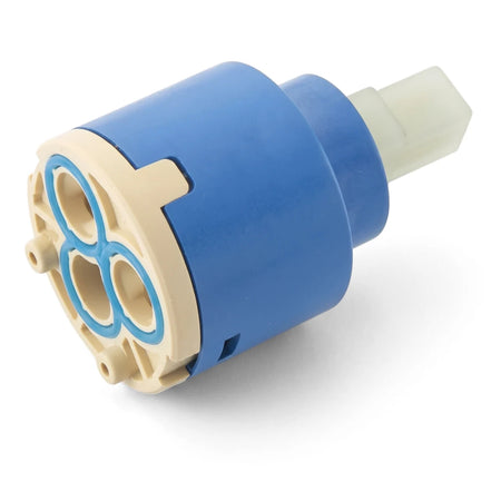 A blue and beige plastic Quaddro shower handle cartridge shown at an angle, displaying its cylindrical body and four