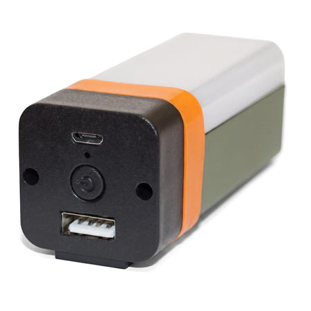 Close-up of a rechargeable 3.5W LED camping and ceiling light with black ends, an orange band, and a green body, showing USB