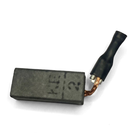 Replacement Carbon Brush Set - 600, featuring a dark rectangular carbon block, copper wire, and black electrical connector.