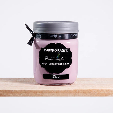 Rose 500ml Tjoko chalk paint in a clear glass jar with a black label, displayed on a wooden shelf.