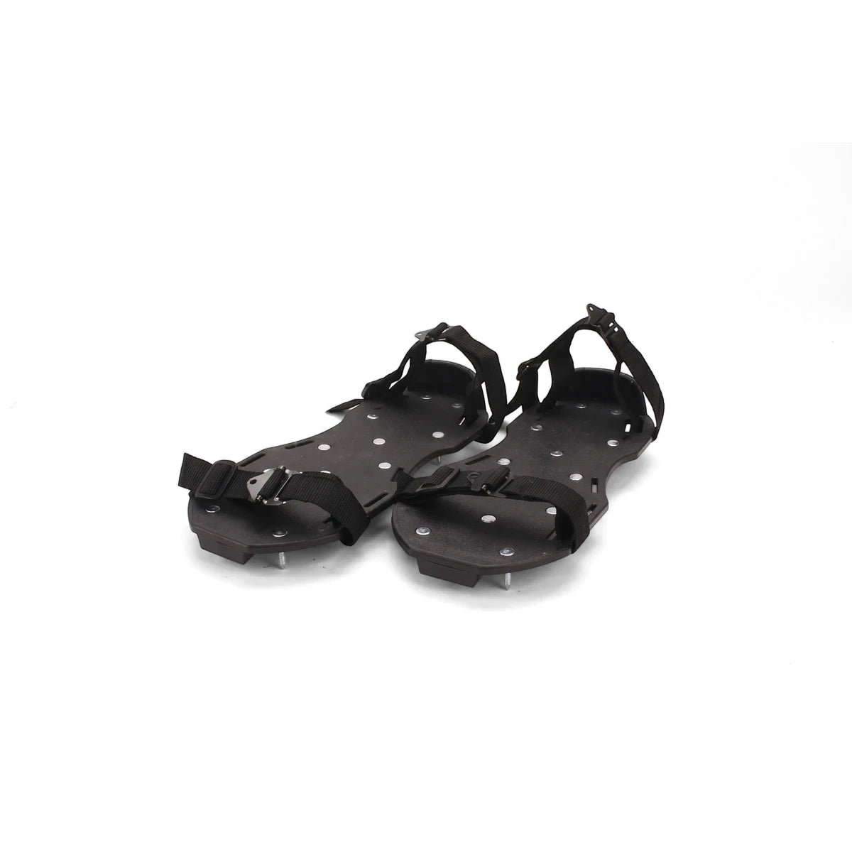 A pair of black Rox Spike Shoes with numerous silver spikes on the soles and adjustable black straps, offering enhanced