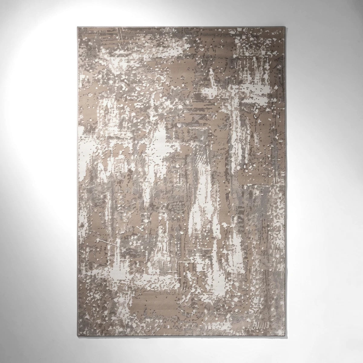 Salamanca Rug Beige, featuring an abstract distressed pattern in beige, brown, and white, displayed in a rectangular shape.