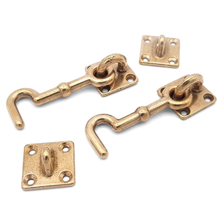 Pair of 75mm Samson brass cabin hooks with matching rectangular eye plates, designed for secure locks and latches.