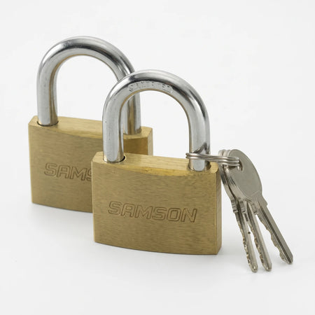 A pair of Samson P/Lock 38mm solid brass padlocks with steel shackles and accompanying keys, displayed together.