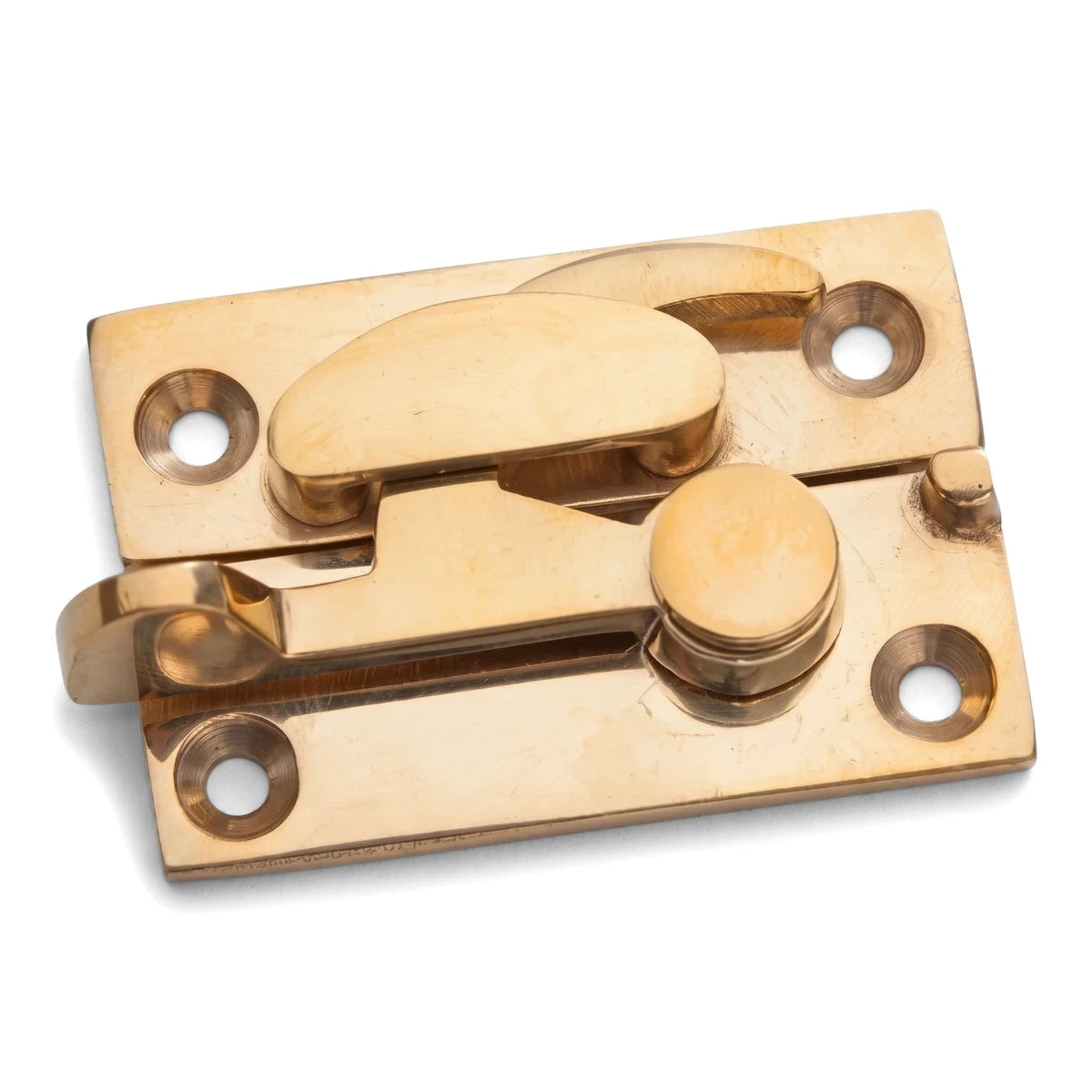 Close-up of a Samson solid brass sash fastener, a polished golden lock and latch mechanism for windows.