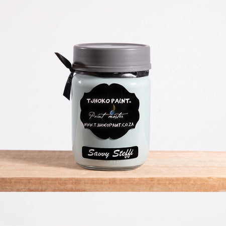 Savvy Steffi 250ml Chalk Paint in a light blue glass jar with a gray lid and black label on a wooden shelf.