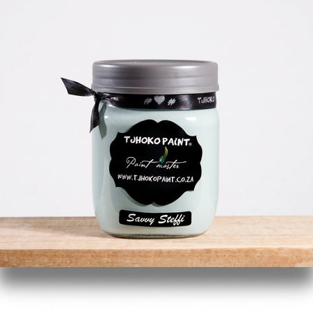 Savvy Steffi 500ml Tjhoko Paint chalk paint jar in light teal on a wooden shelf, featuring a black label and grey lid.