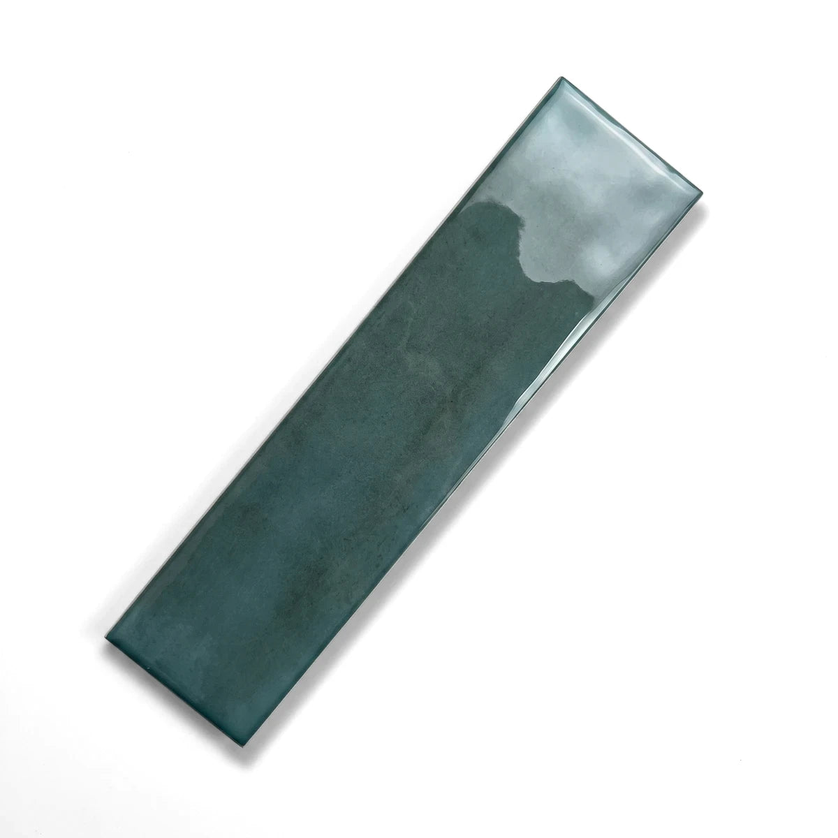 A single glossy sea green subway tile, measuring 75x300mm, displayed diagonally on a gray marble surface.