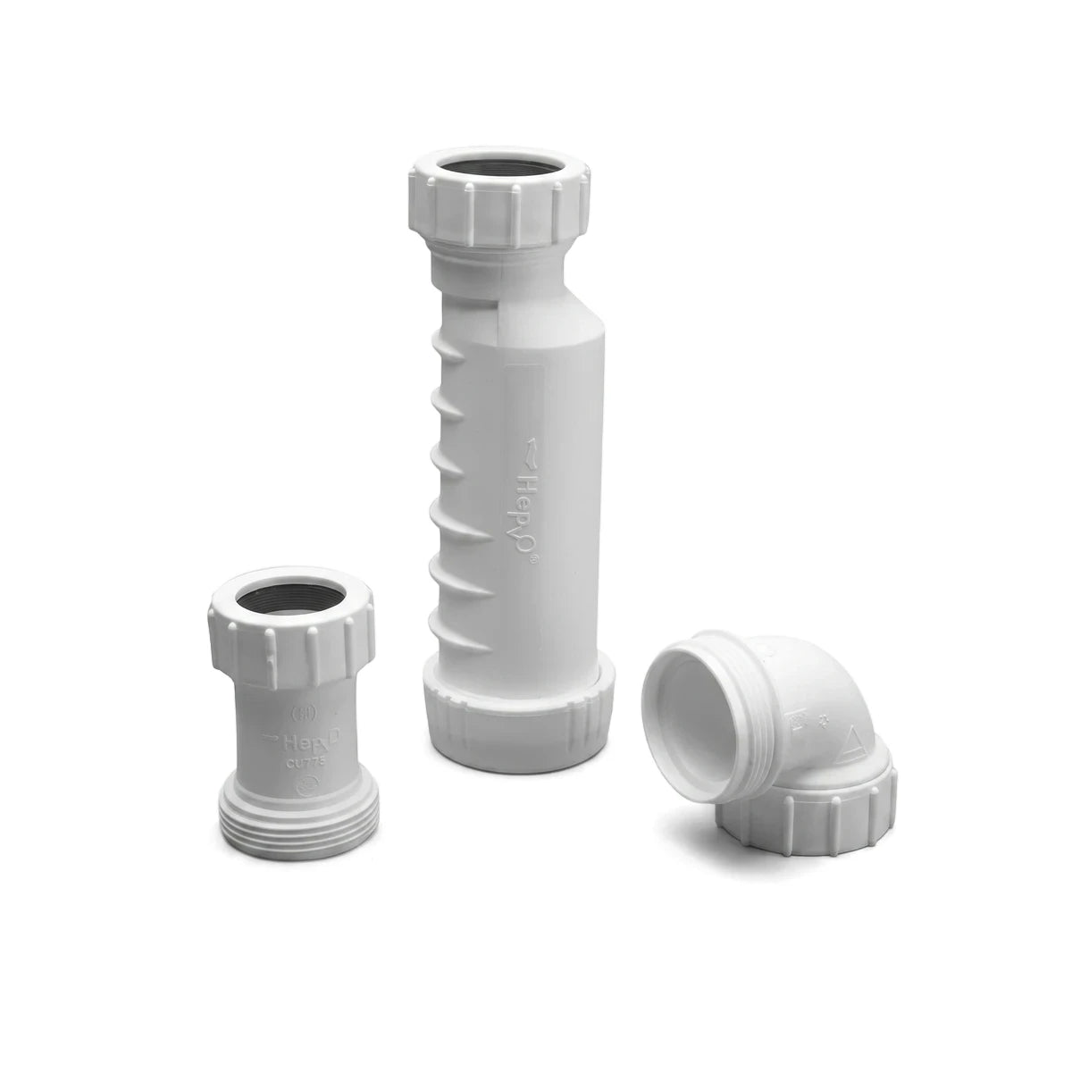 A close-up shot of three white plastic shower channel waterless kit shower parts, including two cylindrical extensions and